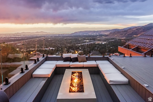 3826 E Thousand Oaks Cir, Salt Lake City, UT 84124 - deck at dusk featuring an outdoor fire pit and a mountain view