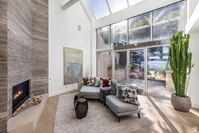 3826 E Thousand Oaks Cir, Salt Lake City, UT 84124 - interior space featuring baseboards, high vaulted ceiling, a tiled fireplace, and wood finished floors