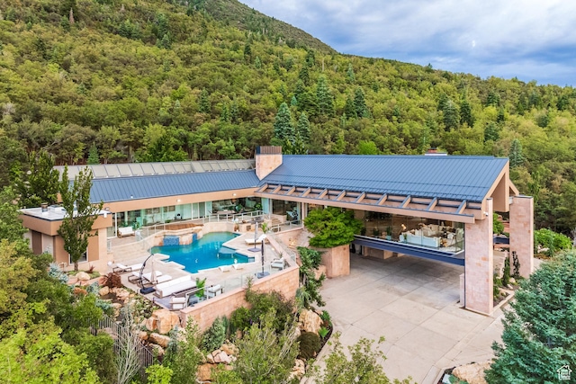 3826 E Thousand Oaks Cir, Salt Lake City, UT 84124 - pool featuring a patio and a wooded view