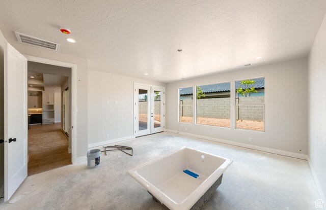1519 N Horizon Pkwy Unit 98, Washington, UT 84780 - unfurnished living room with french doors, recessed lighting, and baseboards