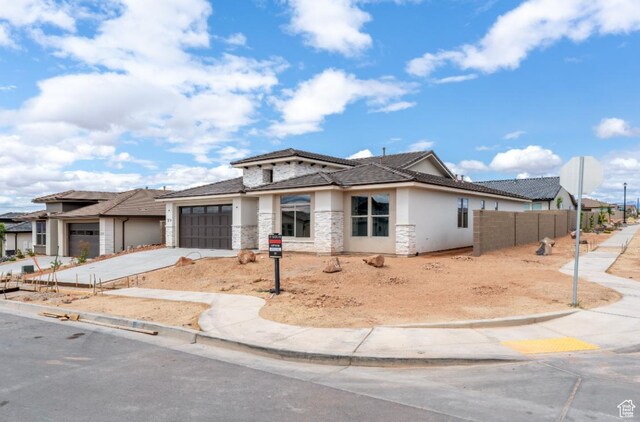 1519 N Horizon Pkwy Unit 98, Washington, UT 84780 - prairie-style home featuring a garage, driveway, stucco siding, and stone siding