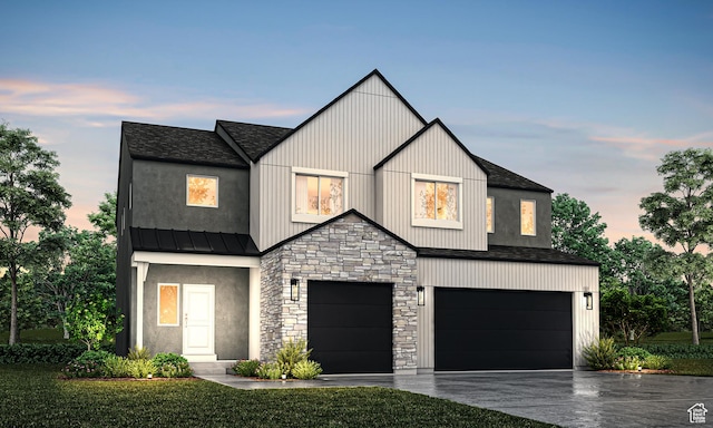 modern farmhouse with driveway, a garage, stone siding, metal roof, and a standing seam roof