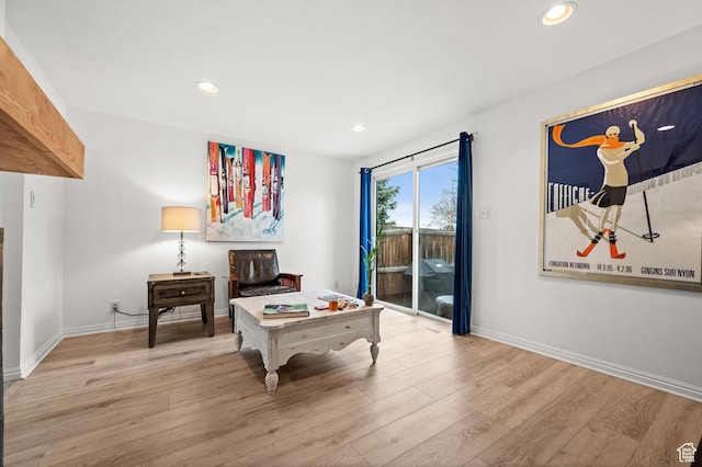 playroom featuring baseboards, wood finished floors, and recessed lighting