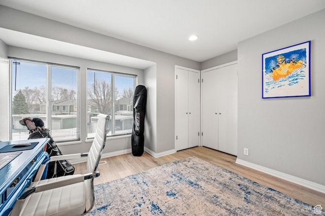 office with recessed lighting, light wood-style flooring, and baseboards