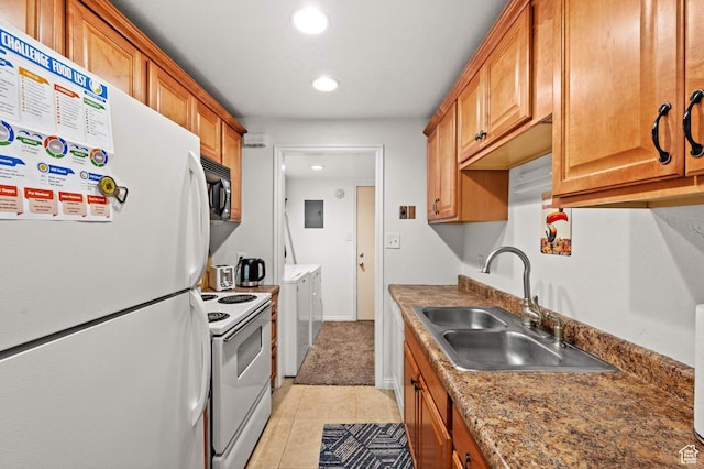 kitchen with washer and clothes dryer, light tile patterned floors, a sink, white appliances, and electric panel