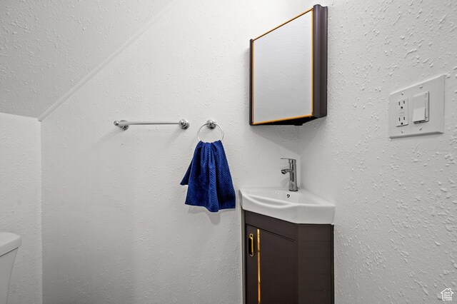 half bath with toilet and vanity