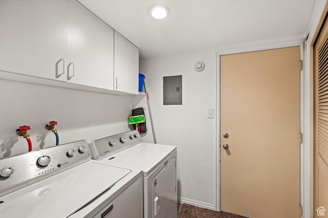 clothes washing area with baseboards, independent washer and dryer, cabinet space, and electric panel