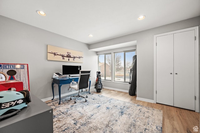 office featuring recessed lighting, baseboards, and wood finished floors