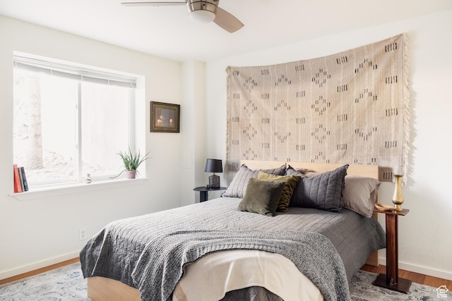 525 S 900 E Unit C1, Salt Lake City, UT 84102 - bedroom with multiple windows, baseboards, and wood finished floors