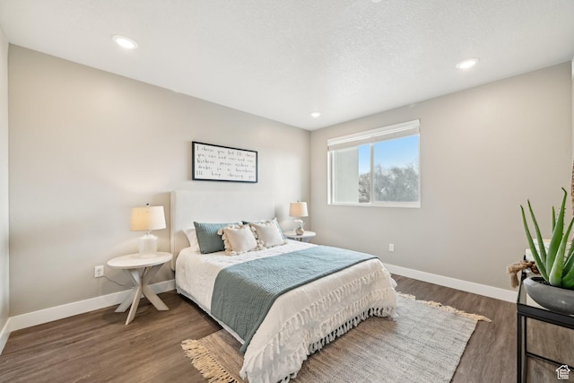 2101 N Main St W Unit 302, Sunset, UT 84015 - bedroom featuring a textured ceiling, recessed lighting, wood finished floors, and baseboards