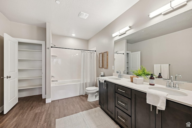 2101 N Main St W Unit 302, Sunset, UT 84015 - bathroom featuring toilet, double vanity, a sink, and wood finished floors