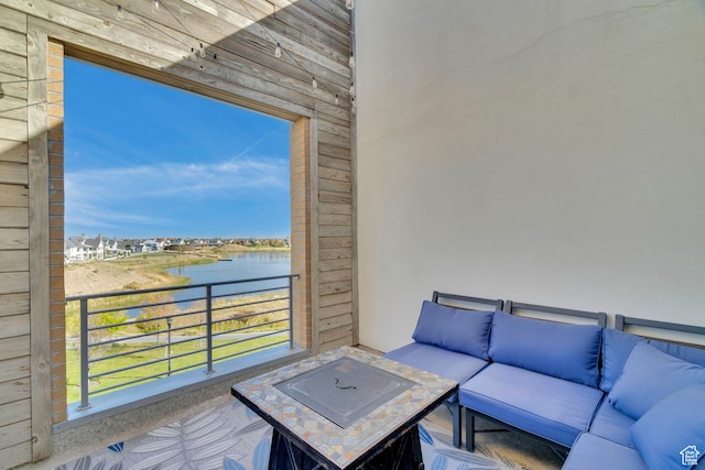 interior space with a water view and an outdoor hangout area