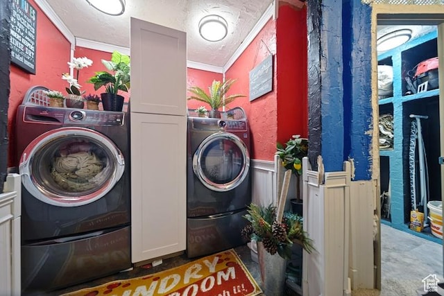 204 W Crescent View Ln N Unit 111, Tooele, UT 84074 - clothes washing area with a wainscoted wall, washer / clothes dryer, cabinet space, and ornamental molding