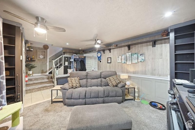 204 W Crescent View Ln N Unit 111, Tooele, UT 84074 - carpeted living area featuring tile patterned flooring, ceiling fan, a textured ceiling, and stairs