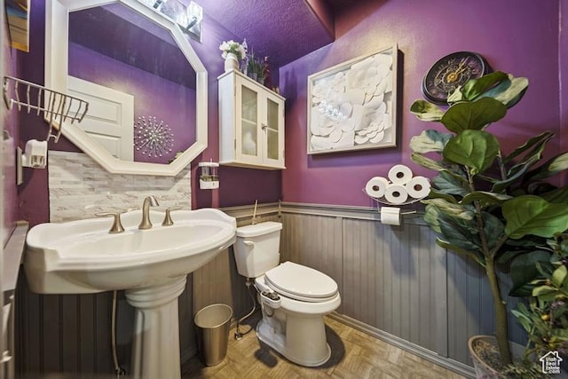 204 W Crescent View Ln N Unit 111, Tooele, UT 84074 - bathroom with wainscoting and toilet