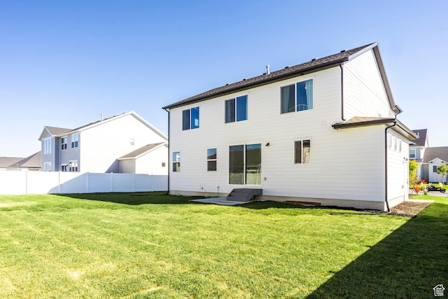 4623 N Festival Way, Eagle Mountain, UT 84005 - back of property featuring a yard, entry steps, and fence