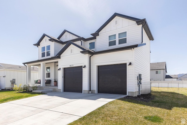 4623 N Festival Way, Eagle Mountain, UT 84005 - modern farmhouse style home featuring concrete driveway, an attached garage, fence, and a front yard
