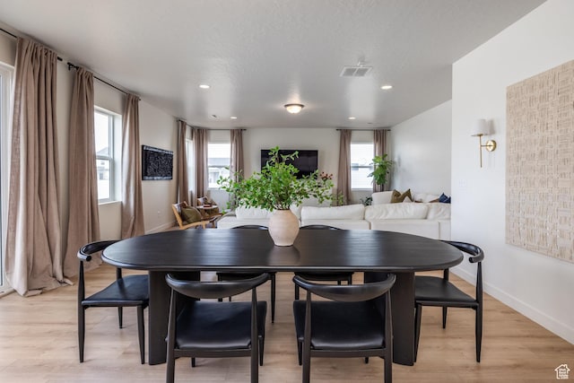 4623 N Festival Way, Eagle Mountain, UT 84005 - dining space with a wealth of natural light, light wood-style floors, and baseboards