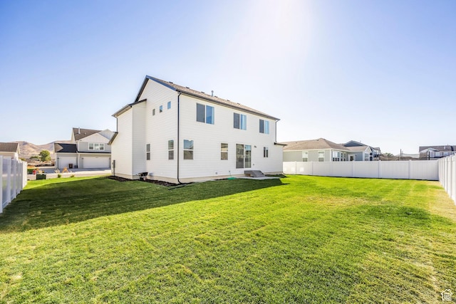 4623 N Festival Way, Eagle Mountain, UT 84005 - back of house featuring fence and a lawn