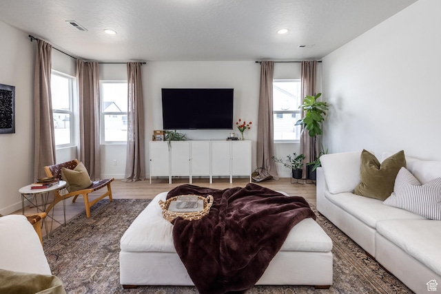 4623 N Festival Way, Eagle Mountain, UT 84005 - living room with plenty of natural light, visible vents, and recessed lighting