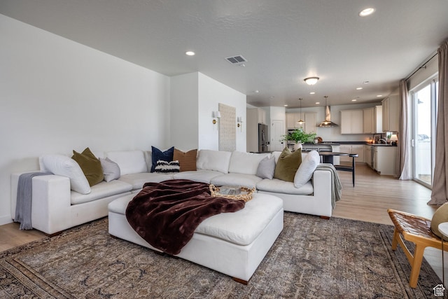 4623 N Festival Way, Eagle Mountain, UT 84005 - living area featuring visible vents, recessed lighting, and light wood-style floors