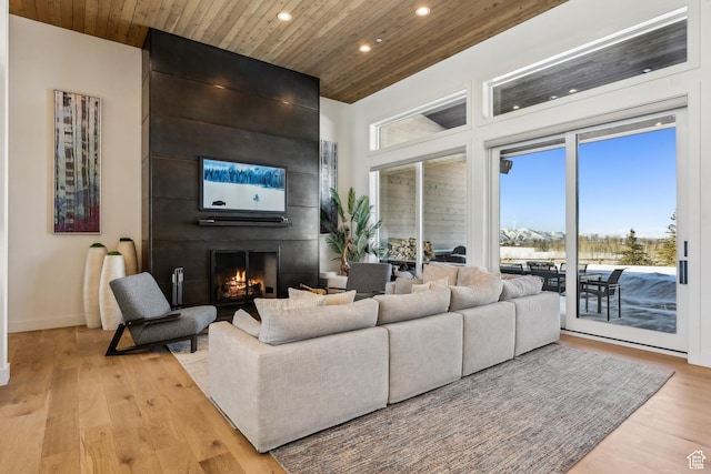 9279 E Aspen Rd, Heber City, UT 84032 - living area with recessed lighting, wood ceiling, light wood finished floors, and a fireplace