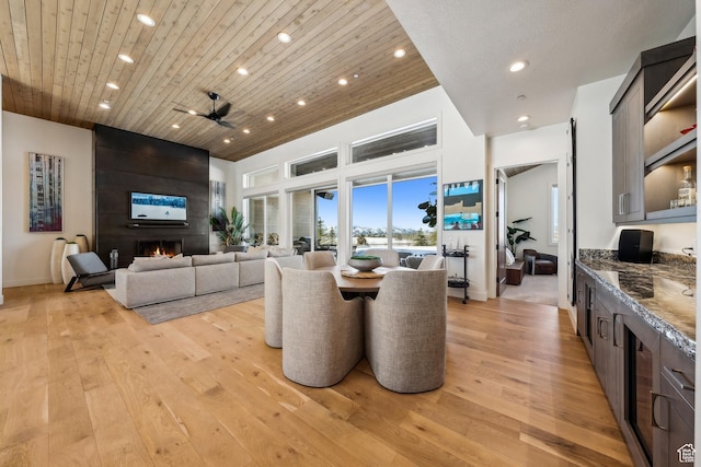 9279 E Aspen Rd, Heber City, UT 84032 - dining area featuring recessed lighting, light wood finished floors, wooden ceiling, a large fireplace, and ceiling fan
