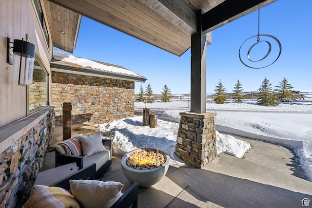 9279 E Aspen Rd, Heber City, UT 84032 - snow covered patio featuring a fire pit and a patio area