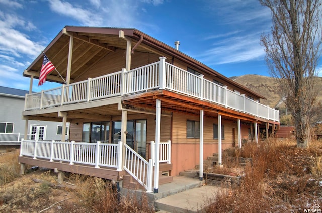 back of property with a deck