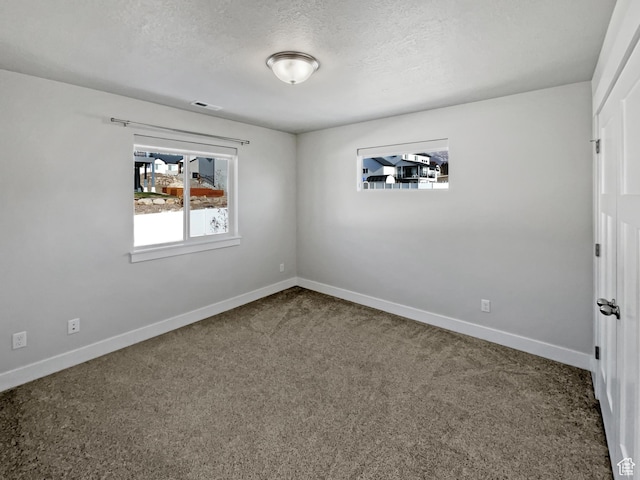 456 E 3675 N, North Ogden, UT 84414 - spare room with baseboards, a textured ceiling, visible vents, and carpet flooring