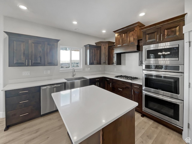 456 E 3675 N, North Ogden, UT 84414 - kitchen with custom range hood, appliances with stainless steel finishes, light countertops, and a sink