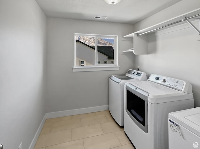 456 E 3675 N, North Ogden, UT 84414 - washroom featuring washer and clothes dryer, light tile patterned floors, visible vents, laundry area, and baseboards
