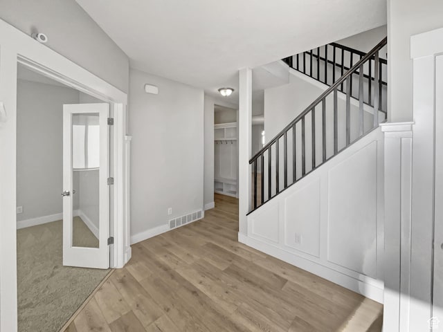 456 E 3675 N, North Ogden, UT 84414 - foyer featuring visible vents, stairway, baseboards, and wood finished floors