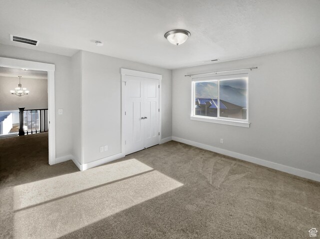 456 E 3675 N, North Ogden, UT 84414 - unfurnished bedroom with a chandelier, visible vents, carpet floors, and baseboards