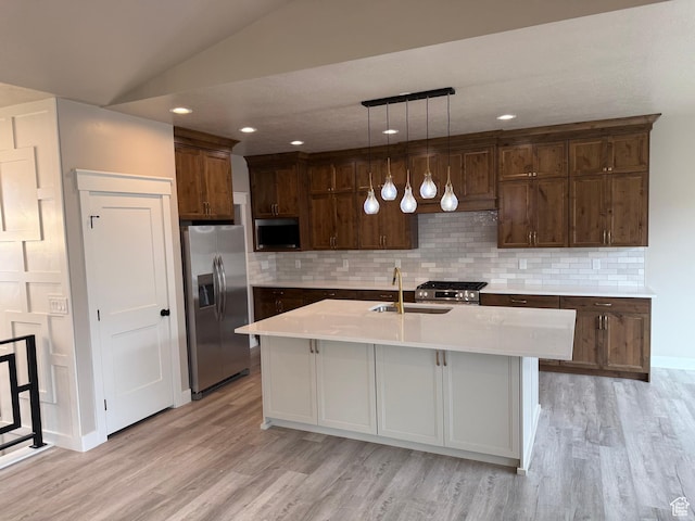 250 S 1100 E, Smithfield, UT 84335 - kitchen featuring light wood-style floors, light countertops, a sink, and appliances with stainless steel finishes
