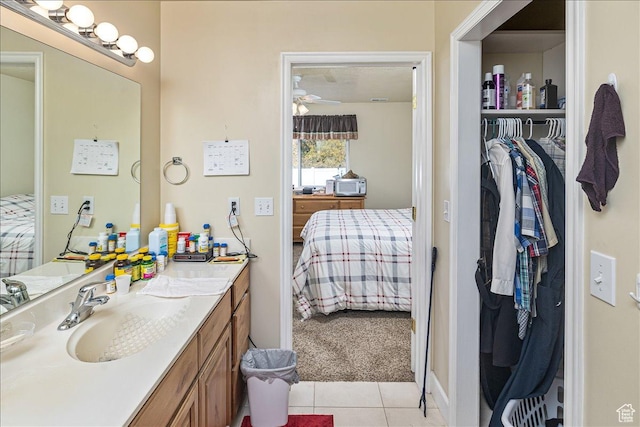 275 W 60 S, Hyde Park, UT 84318 - bathroom with ensuite bath, ceiling fan, tile patterned flooring, a spacious closet, and vanity