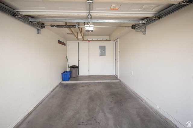 3246 E Fairway Loop, Moab, UT 84532 - garage featuring electric panel and a garage door opener