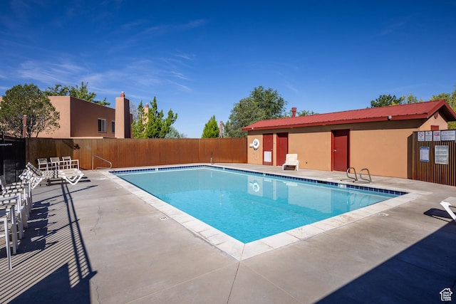 3246 E Fairway Loop, Moab, UT 84532 - community pool featuring a patio and fence