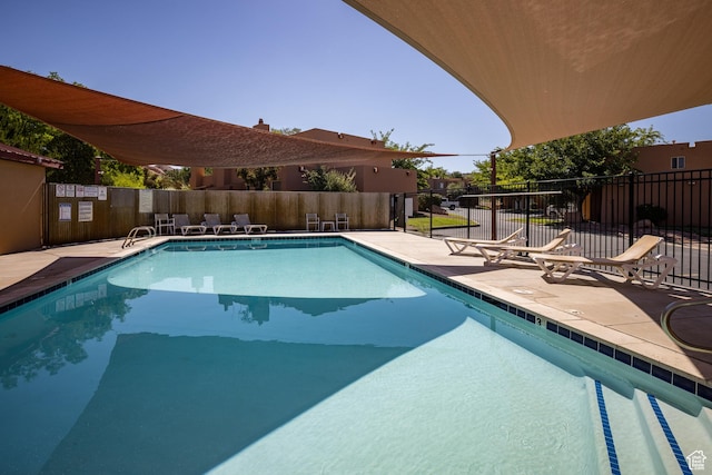 3246 E Fairway Loop, Moab, UT 84532 - pool with a patio and fence