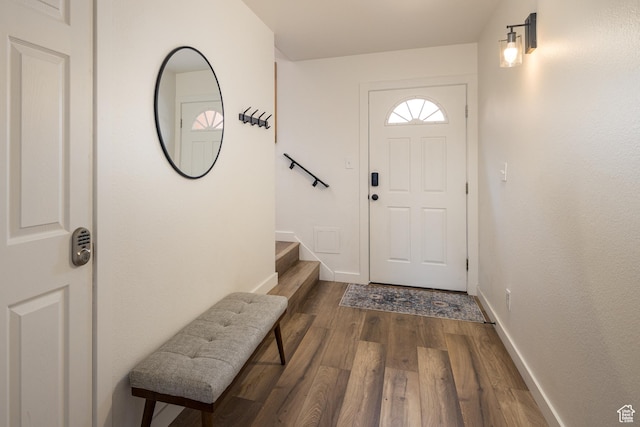 3246 E Fairway Loop, Moab, UT 84532 - foyer featuring dark wood-style floors, stairs, and baseboards