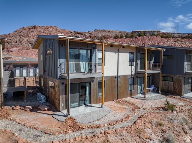 1185 S Murphy Ln Unit 105A, Moab, UT 84532 - back of house with a patio and a mountain view