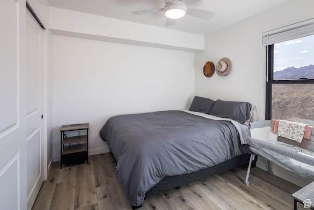 1185 S Murphy Ln Unit 105A, Moab, UT 84532 - bedroom with a closet, wood finished floors, and a ceiling fan