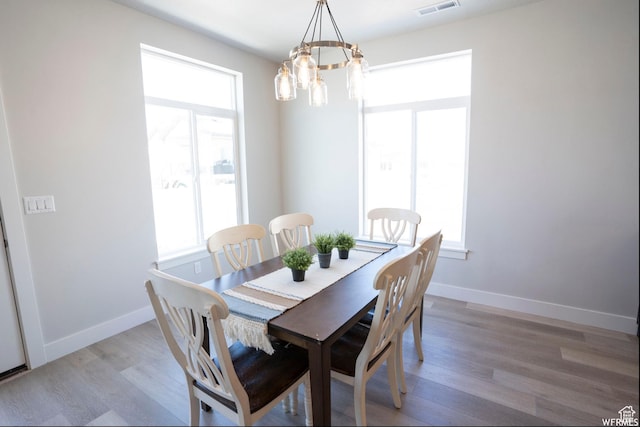 3966 W 2025 S, Taylor, UT 84401 - dining area featuring light wood-type flooring, visible vents, and baseboards