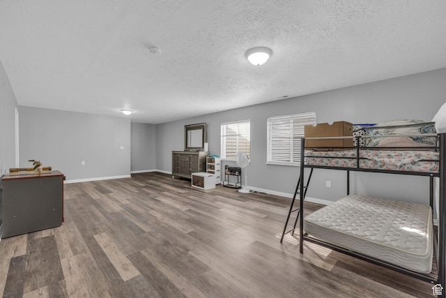 8282 S 6430 W, West Jordan, UT 84081 - bedroom with a textured ceiling, baseboards, and wood finished floors