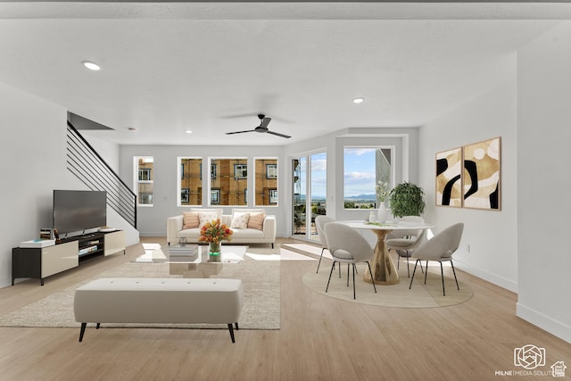 665 E 2015 N # 5E, Cedar City, UT 84721 - living area featuring light wood finished floors, baseboards, ceiling fan, stairway, and recessed lighting