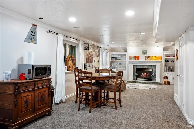 1434 Bennett Cir, Farmington, UT 84025 - dining space with carpet floors, ornamental molding, a textured ceiling, and a tile fireplace