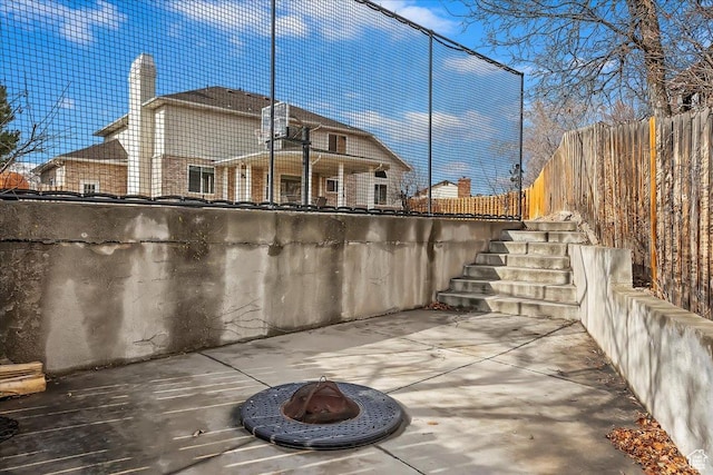 1434 Bennett Cir, Farmington, UT 84025 - view of patio / terrace with stairway, an outdoor fire pit, and fence