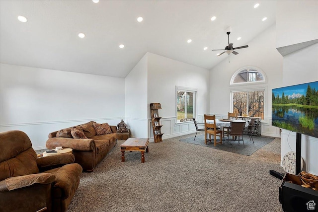 1434 Bennett Cir, Farmington, UT 84025 - carpeted living room featuring high vaulted ceiling, recessed lighting, wainscoting, and a decorative wall