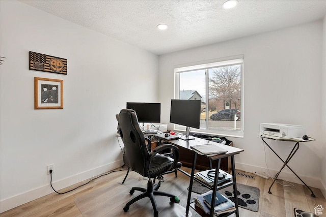 1434 Bennett Cir, Farmington, UT 84025 - office featuring a textured ceiling, light wood-style flooring, and baseboards