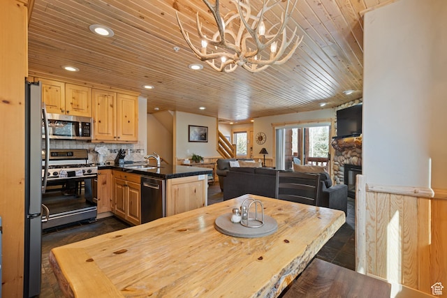 3995 N Timberwolf Ln Unit 1A, Park City, UT 84098 - dining space featuring a chandelier, a stone fireplace, wooden ceiling, recessed lighting, and stairway